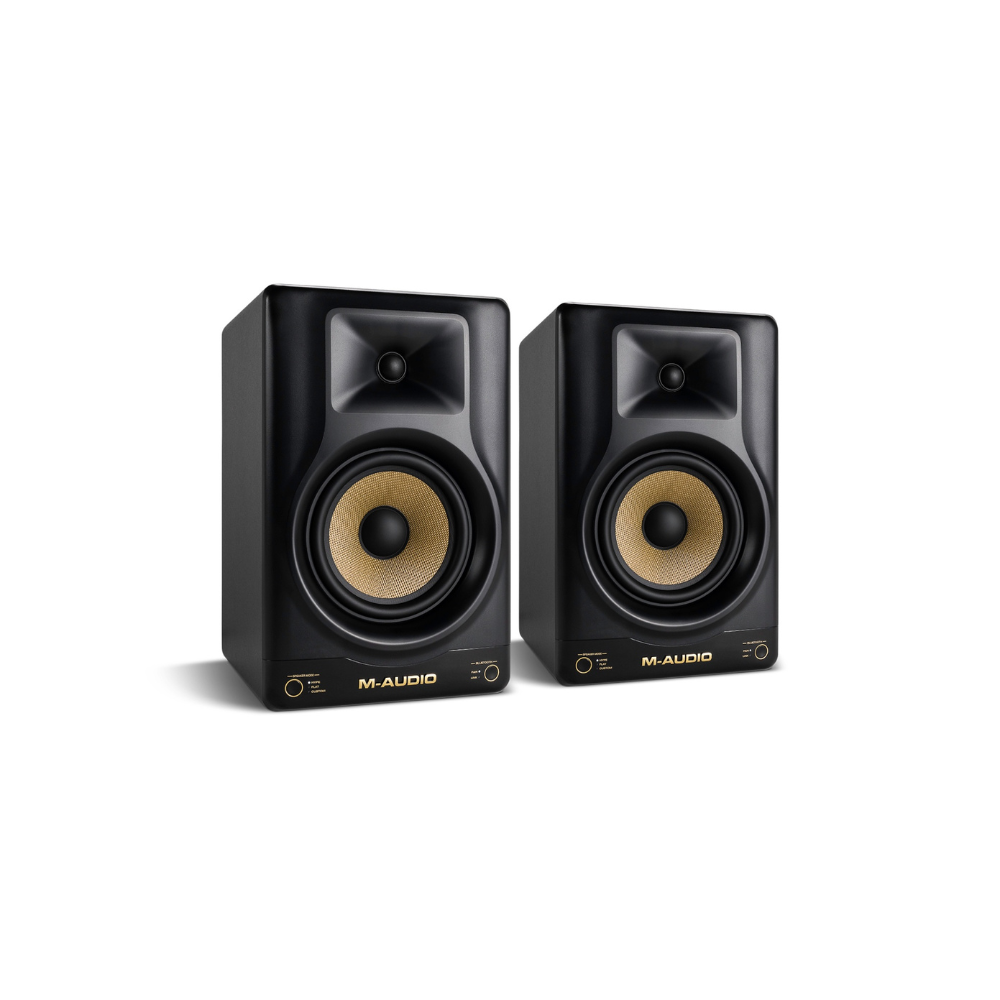 Pair of M-Audio studio monitors on a white background