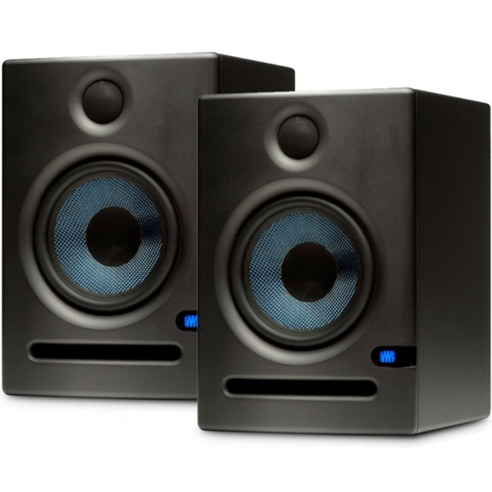 Pair of black studio monitors with blue lights on a white background