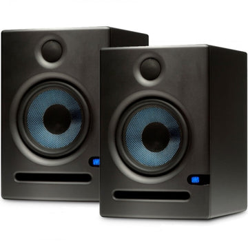 Pair of black studio monitors with blue lights on a white background