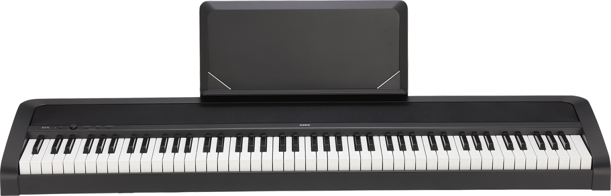 Digital piano with a black amplifier on a white background