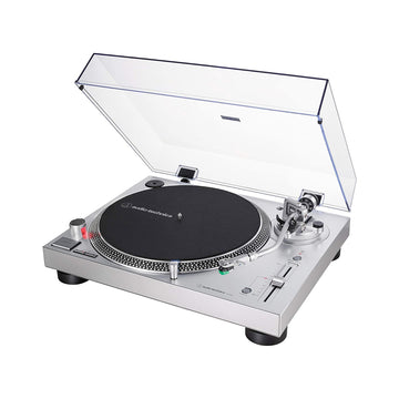Silver turntable with clear dust cover on a white background