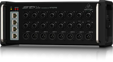 Black audio interface with multiple ports and Behringer branding on a white background