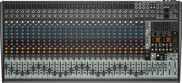 Large audio mixing console with various controls and display panels.