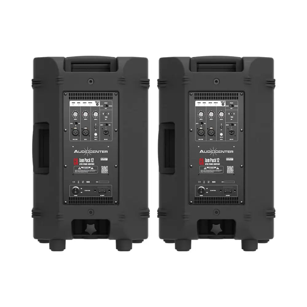 Two black Audiocenter PA speakers on a white background