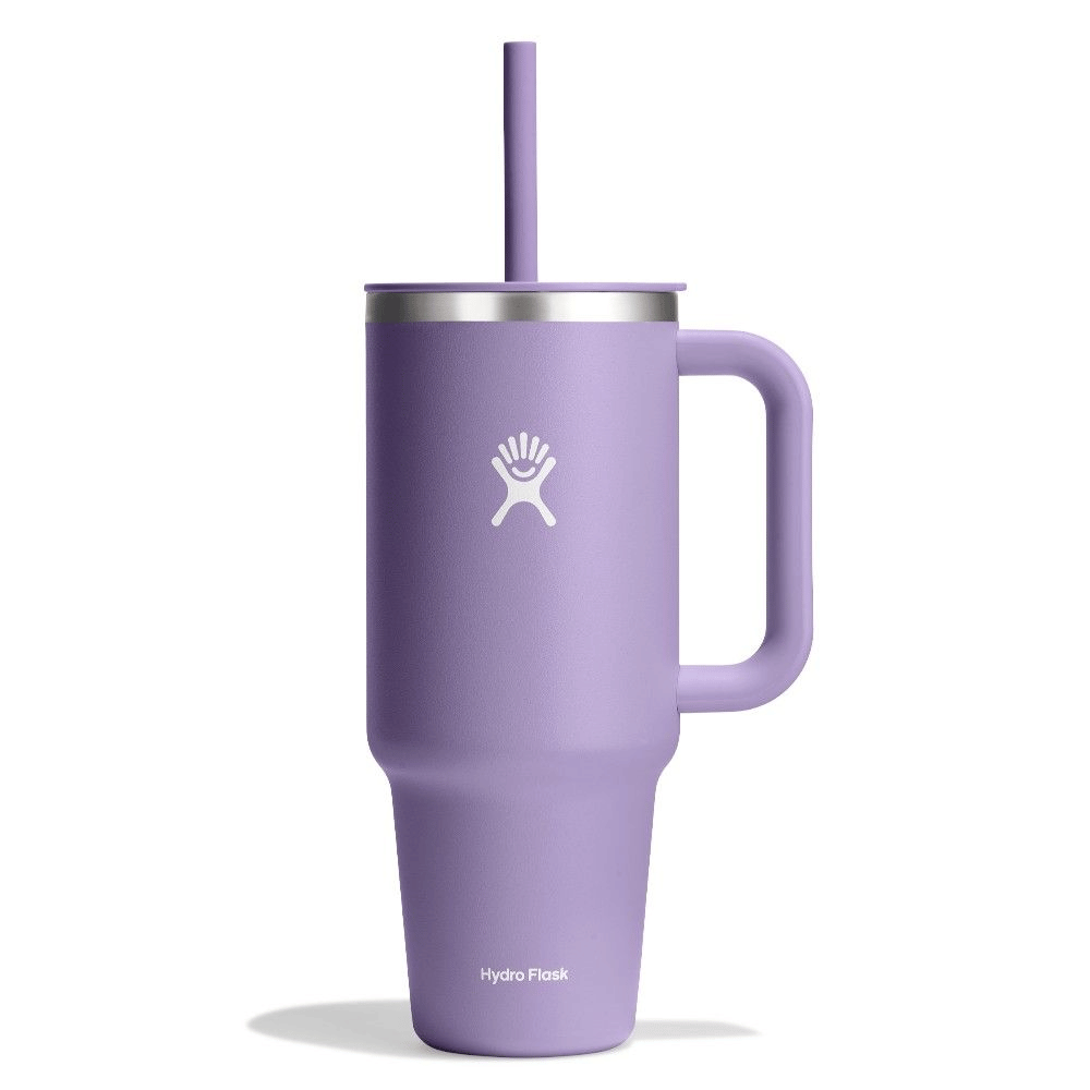 Purple Hydro Flask tumbler with handle and straw on a white background