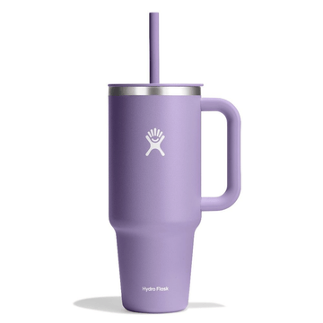 Purple Hydro Flask tumbler with handle and straw on a white background