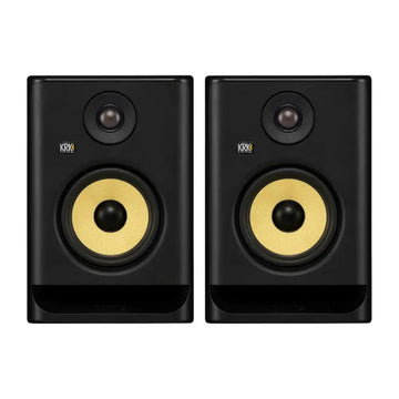 Pair of KRK studio monitors on a white background