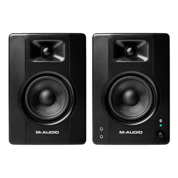 Pair of M-Audio studio monitors on a white background
