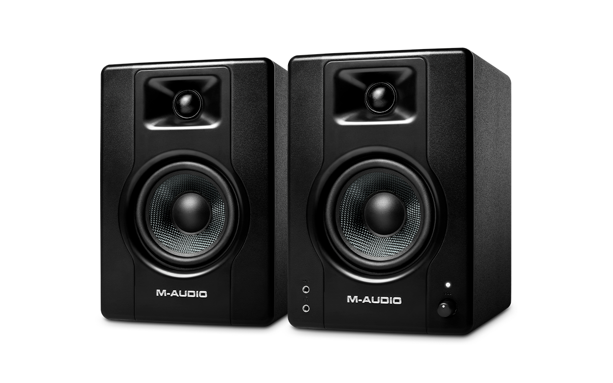 Pair of M-Audio studio monitors on a white background