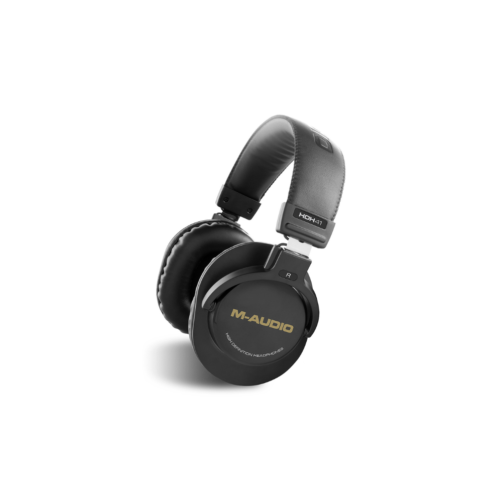 M-Audio audio interface, headphones, and microphone on a white background