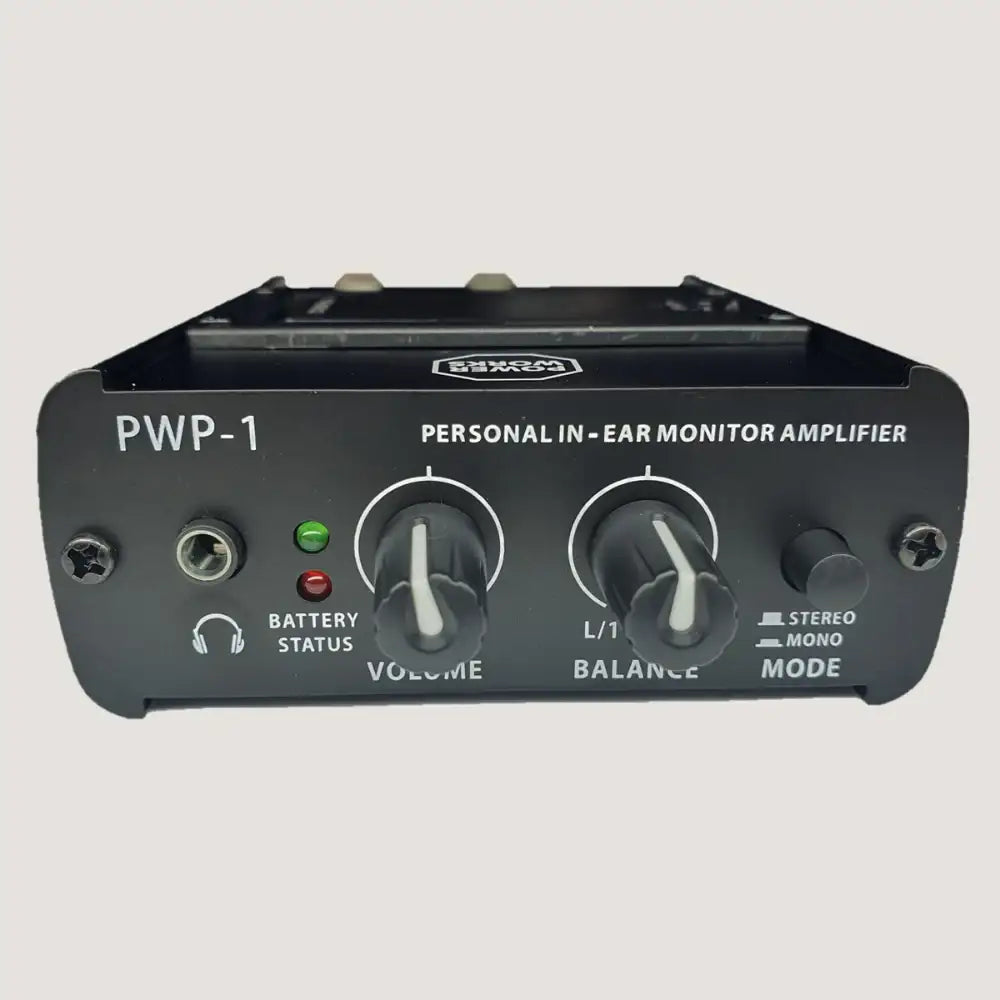 Personal in-ear monitor amplifier with control knobs and indicator lights on a gray background