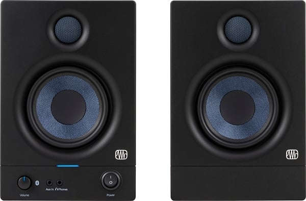Pair of black audio monitors with blue interior on a white background