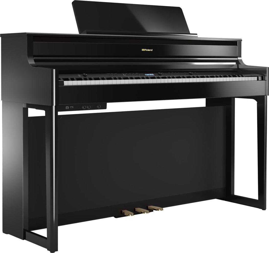 Black digital piano with stand on a white background