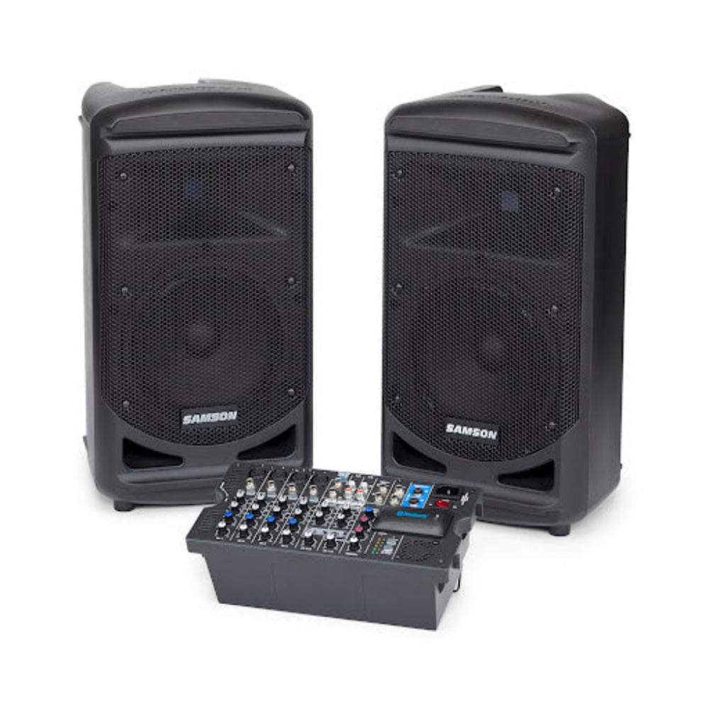 Two black Samson speakers with a mixing console on a white background