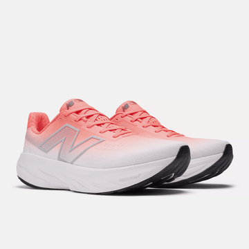 Pair of pink and white running shoes on a light gray background