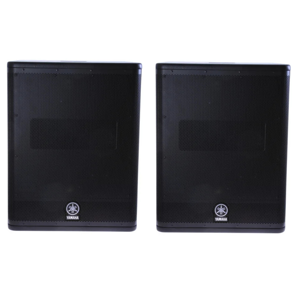 Two black Yamaha speakers on a white background