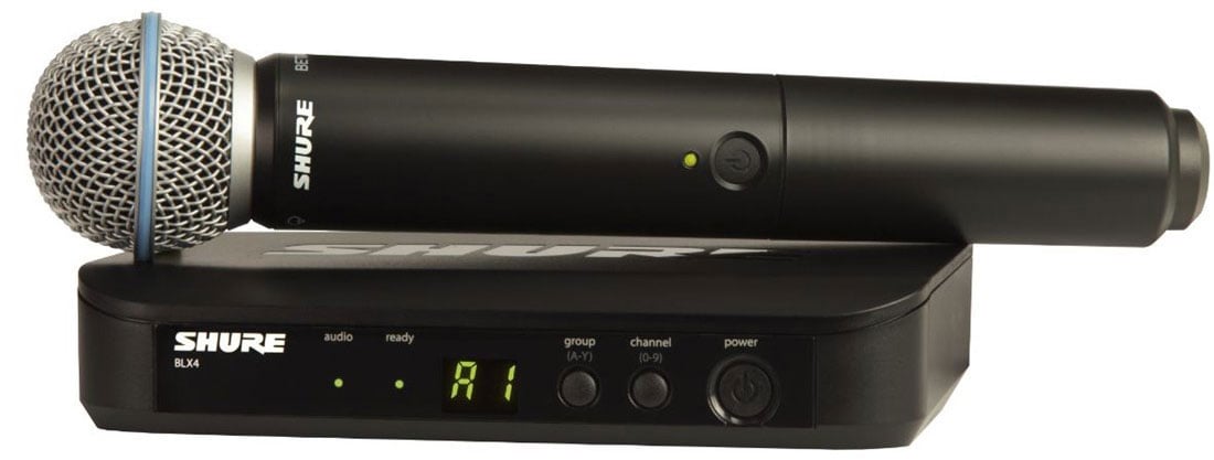 Shure wireless microphone transmitter and receiver on a white background