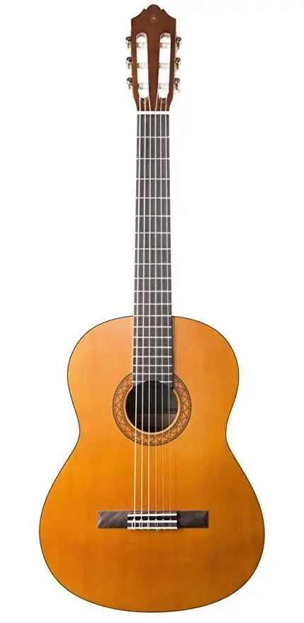Classical guitar with a wooden body and neck on a white background