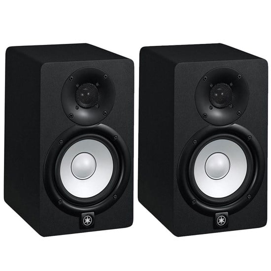 Pair of black studio monitors on a white background
