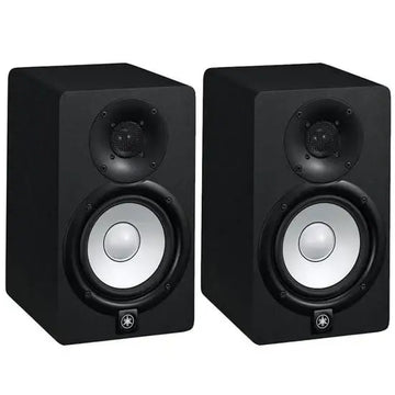 Pair of black studio monitors on a white background